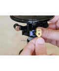 Close-up of hands installing a nozzle on the 2045A Maxi-Paw Sprinkler Bundle With All 7 Nozzles Included Heavy-Duty Impact Drive For Dirty Water