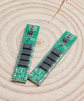 Solid 5 Pack 1S 3.7V 10A Lithium Ion BMS Protection Boards showing two compact green circuit boards with chips.