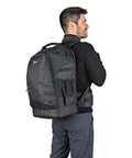 Man wearing Flipside 500 AW II Camera Backpack For Pro DSLR And Mirrorless Gear Fits 400mm Or 500mm Lens Space in black