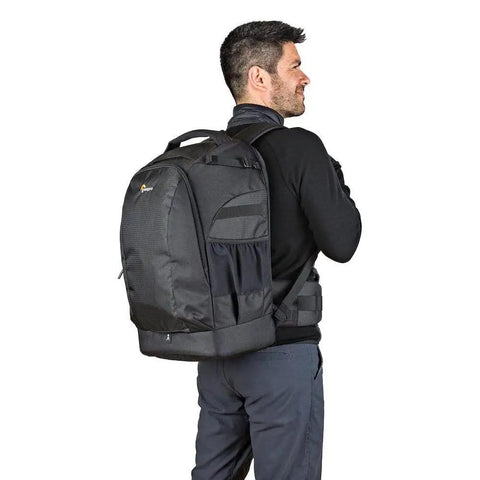 Man wearing Flipside 500 AW II Camera Backpack For Pro DSLR And Mirrorless Gear Fits 400mm Or 500mm Lens Space in black