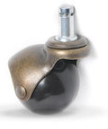 Close-up of a 2 Inch Antique Brass Ball Caster Wheel with black nylon, used for quiet gliding on furniture and office chairs.
