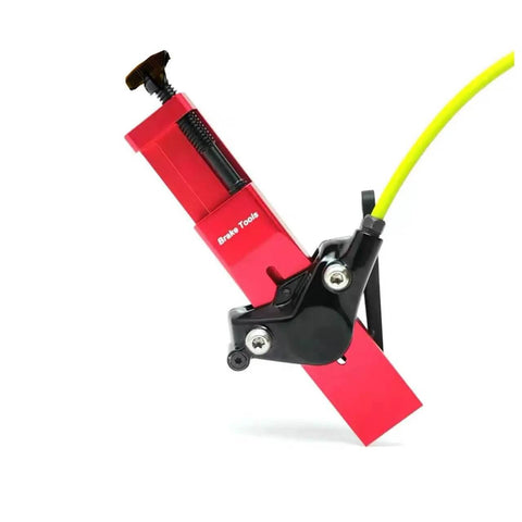 Red SRAM Hydraulic Disc Brake Caliper Piston Press Tool with yellow wire, designed for 2 and 4 piston calipers, 1.1 inch width for bike maintenance.