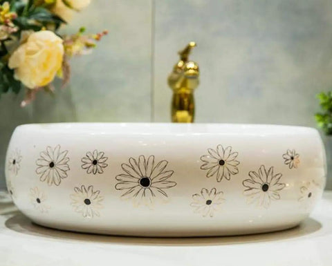 Slick Ceramic Oval Vessel Sink For Modern Bathroom Counters Smooth Glazed Finish with floral design and 12 liter capacity.