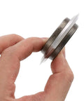 Badass Replacement Blade For Copper Wire Stripping Machine Featuring Built In Bearing Hella Tough High Carbon Steel showing side view in hand
