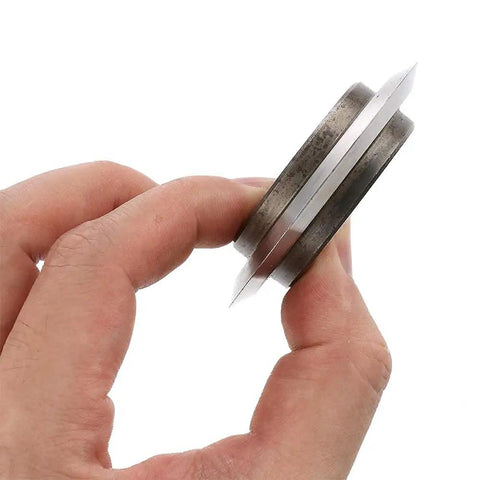 Badass Replacement Blade For Copper Wire Stripping Machine Featuring Built In Bearing Hella Tough High Carbon Steel showing side view in hand
