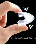 Heavy Duty Crystal Clear Corner Guards For Furniture Bed And Desk 12 Pack L Shaped Adhesive Bumpers held in hand, demonstrating flexibility.