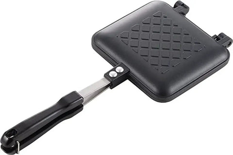 Chomp Out Cheesy, Crispy Panini Wonders With This Aluminum Flip Grill showing lightweight black sandwich press with long handle.