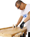 Person using 55 Inch Heavy Duty Rubber Wood Workbench With 3 Drawers Storage Cabinet Tool Well And Adjustable Vise for woodworking