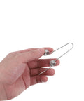 Hand holding Upgrade Your Home With This Awesome 4pcs Stainless Steel Garbage Can Lid Spring Replacement Kit Featuring Dual Torsion Coils For Press Top Lids, High Elasticity, Stable Operation, And Durability For Easy Household Bin DIY Repair Jobs.