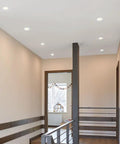 2 Inch Recessed LED Downlight With Premium Anti Glare Trim, 600 Lumens Bright White Glow, 5 Tunable CCT Options For A Sleek Home Lighting Setup Today illuminating a modern hallway.