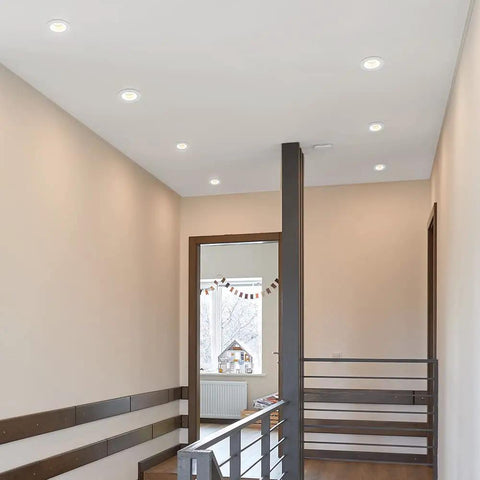 2 Inch Recessed LED Downlight With Premium Anti Glare Trim, 600 Lumens Bright White Glow, 5 Tunable CCT Options For A Sleek Home Lighting Setup Today illuminating a modern hallway.