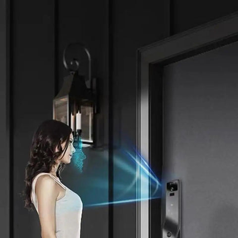 Slick Smart Door Lock Featuring Built In Camera Voice Intercom And Fast Fingerprint Scan Password Entry Along With Hella Secure Auto Deadbolt Delivering Darn Top Shelf Protection Always with woman using intercom.