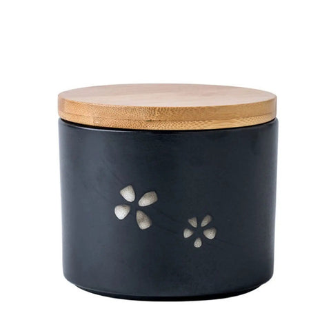 Matte Black Ceramic Coffee Canister With Premium Airtight Seal Keeps Your Daily Grind Fresh No Fuss Wide Mouth Design For Easy Scooping And Reliable Kitchen Pantry Storage with bamboo lid and floral design.