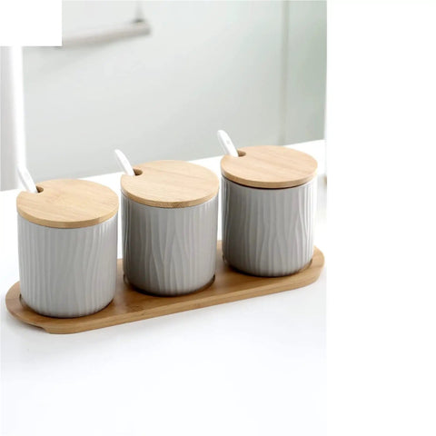 Top Shelf Ceramic Coffee Storage Jar With Secure Wooden Lid And Airtight Design Keeps Daily Grind Sugar Salt Tea Fresh As Ever While Looking Slick On Any Modern Counter Space, set of three jars on bamboo tray.