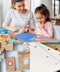 Mother and child crafting with Blue Metal Hole Punch With Soft Grip Handle For DIY Crafts And Scrapbooking, ideal for paper projects.