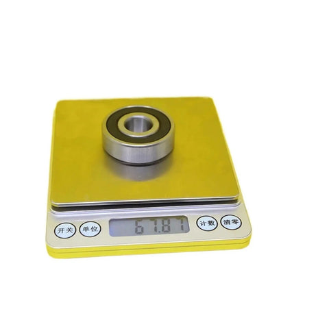 Get Your Hands On This Awesome 6302 Hybrid Ceramic Bearing For High Speed Motors And Heavy Duty Applications Measuring 15 Millimeter By 42 Millimeter By 13 Millimeter With Easy Installation For Serious Radial Load Support on a scale showing weight.