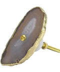 Natural Agate Stone Drawer Knobs With Slick Gold Plated Edge Decorative Cabinet Hardware No Hassle Screw Install For Dressers Wardrobes Super Smooth Durable Finish Hella Stylish Home Upgrade close up of a gold edged agate knob