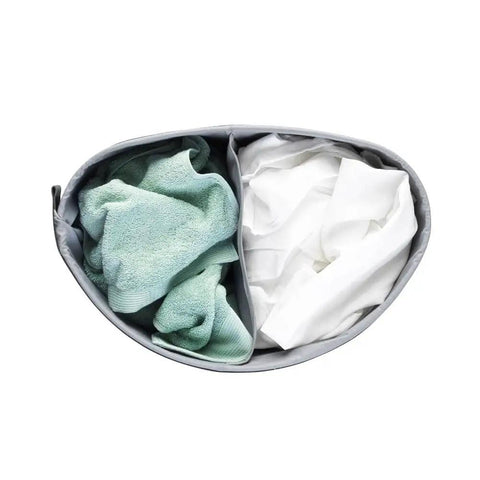 Top view of Big Ol Two-Section Laundry Hamper With Removable Inner Bags showing green and white clothes inside, 14.5 gallon. 