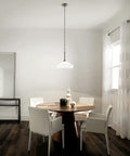Swanky 15 Inch One Light Pendant in satin etched glass with brushed nickel finish over dining table in modern decor