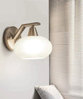 Smooth Modern Wall Sconce With White Glass Shade And Heavy Duty Metal Geometric Design For Kitchen Bedroom Hallway mounted on wall.