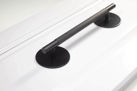 Matte Black Escutcheon Back Plates For Cabinet Knobs And Doors Four Pack Round Rosette Plate Two And One Third Inch Heavy Duty Die Cast Zinc Ideal For Bifold Closet Doors Door Pulls And Handles installed on a white surface.
