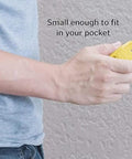 Hand holding a compact yellow BSTiltion Magnetic Stud Finder for Wall Mounting Projects, designed for easy pocket storage.