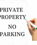 Hand writing on a Set Of Two Hella Durable White Aluminum Sign Blanks 18 X 12 Inch Rust Free Sheet Metal for no parking notice.