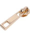 Close-up of a zipper pull from the 5 Piece Zipper Sliders Set For Quick On The Go Fixes Detachable Reusable Zipper Pulls Replacement Kit in Light Gold.