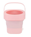 No Sweat Foldable Mini Washing Machine, Portable Compact Washer in pink, designed for quick cycles and small spaces.