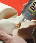 Applying Clear Industrial Adhesive With UV Resistance For Outdoor Use Built For Tough Bonding And High Flexibility 3.7 Fluid Ounces to fabric