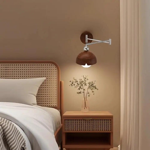 Swing Arm Wall Sconce, Modern Wood Lamp Bedside Reading Bedroom with wood shade and chrome arm beside a bed.