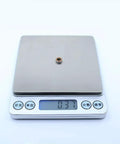 10Pcs MR85RS MR85 2RS Orange Sealed Ball Bearings 5x8x2.5 mm ABEC-3 on digital scale showing 0.37 grams