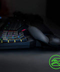 Side view of Mecha-Membrane Gaming Keypad With 32 Programmable Keys, Customizable RGB Lighting, and ergonomic design for gaming.
