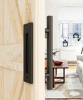12 Inch Sliding Barn Door Handles And Pulls Double Sided Hardware Set installed on a wooden door opening to a living room