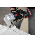 18V 16 Gauge Nibbler with Brushless Motor cutting sheet metal, showing rotating die holder, cordless use visible