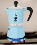 Rainbow Stovetop Espresso Maker Moka Pot For 3 Cups Aluminum Light Blue With Easy Pour Spout And Ergonomic Anti Scald Handle for home use.