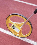 Heavy Duty Measuring Wheel With Molded Rubber Tire And Five Digit Counter Tracks Ten Thousand Feet Adjustable Telescoping Handle on track