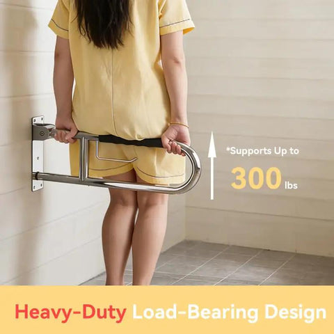 Real Deal 32 Inch Flip Up Toilet Safety Handle In Brushed Nickel Featuring Built In Paper Dispenser And Anti Slip Rubber Knobs Beefy 304 Stainless Steel Construction For Dependable Handicap Assistance And Wheelchair Accessible Restroom Design, showing support rail in use.