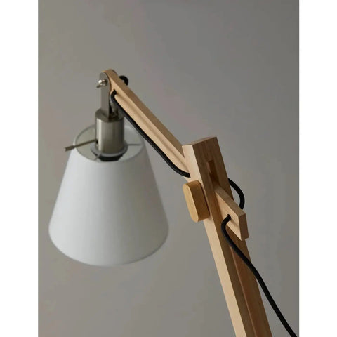 Close-up of Walden Floor Lamp With Natural Wood Body On Satin Steel Base, Off White Poly Cotton Bell Shade, adjustable height feature.