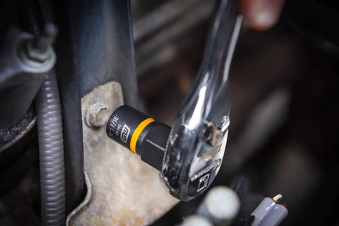 Close-up of Fifteen Piece One Quarter Inch And Three Eighth Inch Drive Bolt Biter Impact Extraction Socket Set for damaged fasteners in use