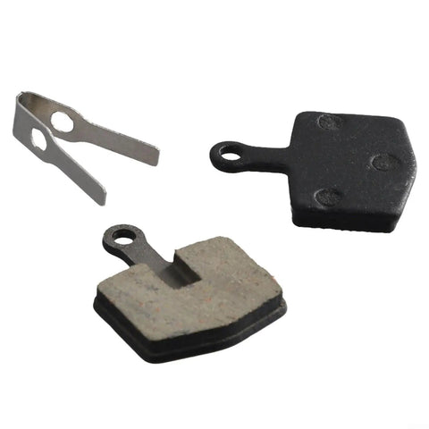 Organic Sintered Metal Disc Brake Pads For Mountain, Trail, And Urban Riding shown with spring clip, 26mm by 20mm