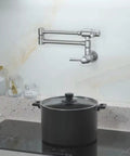 Pro Grade Stainless Steel Pot Filler Faucet For Wall Mount Kitchen Sink next to stove, folded away, in a modern kitchen setting.