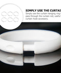 Close-up of 36 Pack Large Plastic Curtain Rings For Shower And Window Curtains With Smooth Glide Hooks in classic white.