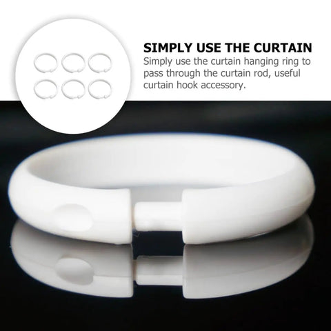 Close-up of 36 Pack Large Plastic Curtain Rings For Shower And Window Curtains With Smooth Glide Hooks in classic white.