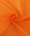 Close up of Orange Sheer Voile Window Curtain Panels 52 Inch Wide 84 Inch Long Rod Pocket 2 Panels Lightweight Polyester Sheers fabric.