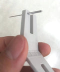 Close-up of Two Piece Hump Jumper Sewing Tools Set For Quilting And Hemming showing precise needle placement