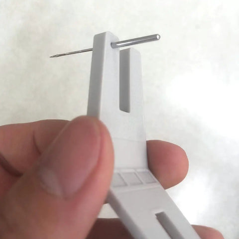 Close-up of Two Piece Hump Jumper Sewing Tools Set For Quilting And Hemming showing precise needle placement