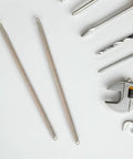 Automatic Door Closer Spring Set With Hooks For Doors And Cabinets shown with tools on a white background