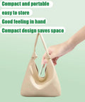 Hand holding Two-In-One Sewing Needle Threader And Seam Ripper, Versatile Tool For Sewing, Quilting inside beige bag