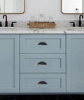 Light blue cabinet with 10 Pack Matte Black Cabinet Drawer Pulls 3.3 Inch Length Zinc Alloy Cup Pulls For Kitchen Hardware installed